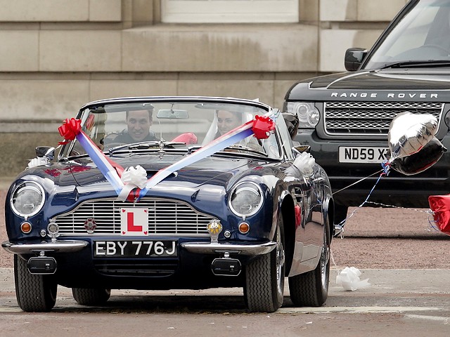 Royal Wedding England Prince William and Catherine depart for Honeymoon in Aston Martin from Buckingham Palace London - Prince William, Duke of Cambridge and his wife Catherine, Duchess of Cambridge, depart for their honeymoon from Buckingham Palace, in dark blue Aston Martin DB6 MKII Volante, taken in loan from Prince Charles, after ceremony of the royal wedding, on April 29, 2011 in London, England, the biggest royal event in Britain for the last 30 years. The car of newlyweds  was followed only by Range Rover of security service. - , Royal, wedding, weddings, England, prince, princes, William, Catherine, honeymoon, honeymoons, Aston, Martin, Buckingham, palace, palaces, London, autos, auto, car, cars, automobiles, automobile, show, shows, celebrities, celebrity, ceremony, ceremonies, event, events, entertainment, entertainments, place, places, travel, travels, tour, tours, duke, dukes, Cambridge, wife, wifes, duchess, duchesses, dark, blue, DB6, MKII, Volante, loan, loans, Charles, April, 2011, England, biggest, event, events, Britain, years, year, newlyweds, newlywed, Range, Rover, security, service, services - Prince William, Duke of Cambridge and his wife Catherine, Duchess of Cambridge, depart for their honeymoon from Buckingham Palace, in dark blue Aston Martin DB6 MKII Volante, taken in loan from Prince Charles, after ceremony of the royal wedding, on April 29, 2011 in London, England, the biggest royal event in Britain for the last 30 years. The car of newlyweds  was followed only by Range Rover of security service. Решайте бесплатные онлайн Royal Wedding England Prince William and Catherine depart for Honeymoon in Aston Martin from Buckingham Palace London пазлы игры или отправьте Royal Wedding England Prince William and Catherine depart for Honeymoon in Aston Martin from Buckingham Palace London пазл игру приветственную открытку  из puzzles-games.eu.. Royal Wedding England Prince William and Catherine depart for Honeymoon in Aston Martin from Buckingham Palace London пазл, пазлы, пазлы игры, puzzles-games.eu, пазл игры, онлайн пазл игры, игры пазлы бесплатно, бесплатно онлайн пазл игры, Royal Wedding England Prince William and Catherine depart for Honeymoon in Aston Martin from Buckingham Palace London бесплатно пазл игра, Royal Wedding England Prince William and Catherine depart for Honeymoon in Aston Martin from Buckingham Palace London онлайн пазл игра , jigsaw puzzles, Royal Wedding England Prince William and Catherine depart for Honeymoon in Aston Martin from Buckingham Palace London jigsaw puzzle, jigsaw puzzle games, jigsaw puzzles games, Royal Wedding England Prince William and Catherine depart for Honeymoon in Aston Martin from Buckingham Palace London пазл игра открытка, пазлы игры открытки, Royal Wedding England Prince William and Catherine depart for Honeymoon in Aston Martin from Buckingham Palace London пазл игра приветственная открытка
