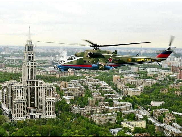 Victory Day in Moscow MI-24 flies over the City - A military helicopter MI-24 of the Berkuty flies over the city during the Victory Day parade in Moscow (May 9, 2010). - , Victory, Day, Moscow, MI-24, city, cities, show, shows, place, places, performance, performances, military, helicopter, helicopters, Berkuty, parade, parades, May, 2010 - A military helicopter MI-24 of the Berkuty flies over the city during the Victory Day parade in Moscow (May 9, 2010). Решайте бесплатные онлайн Victory Day in Moscow MI-24 flies over the City пазлы игры или отправьте Victory Day in Moscow MI-24 flies over the City пазл игру приветственную открытку  из puzzles-games.eu.. Victory Day in Moscow MI-24 flies over the City пазл, пазлы, пазлы игры, puzzles-games.eu, пазл игры, онлайн пазл игры, игры пазлы бесплатно, бесплатно онлайн пазл игры, Victory Day in Moscow MI-24 flies over the City бесплатно пазл игра, Victory Day in Moscow MI-24 flies over the City онлайн пазл игра , jigsaw puzzles, Victory Day in Moscow MI-24 flies over the City jigsaw puzzle, jigsaw puzzle games, jigsaw puzzles games, Victory Day in Moscow MI-24 flies over the City пазл игра открытка, пазлы игры открытки, Victory Day in Moscow MI-24 flies over the City пазл игра приветственная открытка