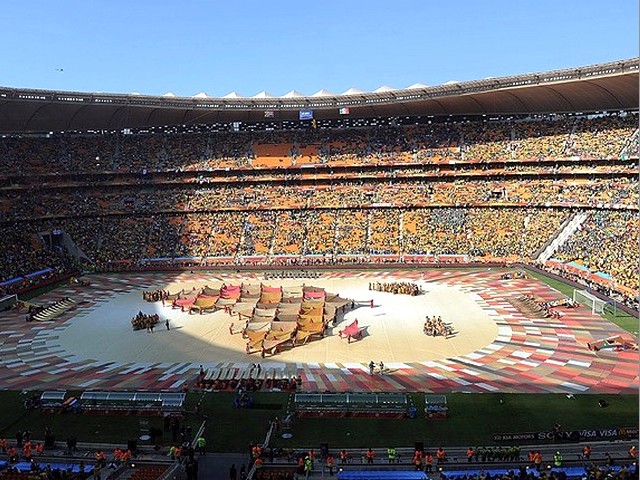 World Cup 2010 a Map of Africa - Performers form a map of Africa from coloured blankets while Timothy Moloi sings the World Cup anthem 'Hope' during the Opening Ceremony of the FIFA World Cup 2010 at the Soccer City stadium in Johannesburg, South Africa (June 11, 2010). - , World, Cup, 2010, map, maps, Africa, show, shows, performance, performances, sport, sports, tournament, tournaments, qualification, qualifications, ceremony, ceremonies, match, matches, performer, performers, blanket, blankets, Timothy, Moloi, anthem, anthems, 'Hope', Opening, FIFA, Soccer, City, stadium, stadiums, Johannesburg, South - Performers form a map of Africa from coloured blankets while Timothy Moloi sings the World Cup anthem 'Hope' during the Opening Ceremony of the FIFA World Cup 2010 at the Soccer City stadium in Johannesburg, South Africa (June 11, 2010). Подреждайте безплатни онлайн World Cup 2010 a Map of Africa пъзел игри или изпратете World Cup 2010 a Map of Africa пъзел игра поздравителна картичка  от puzzles-games.eu.. World Cup 2010 a Map of Africa пъзел, пъзели, пъзели игри, puzzles-games.eu, пъзел игри, online пъзел игри, free пъзел игри, free online пъзел игри, World Cup 2010 a Map of Africa free пъзел игра, World Cup 2010 a Map of Africa online пъзел игра, jigsaw puzzles, World Cup 2010 a Map of Africa jigsaw puzzle, jigsaw puzzle games, jigsaw puzzles games, World Cup 2010 a Map of Africa пъзел игра картичка, пъзели игри картички, World Cup 2010 a Map of Africa пъзел игра поздравителна картичка